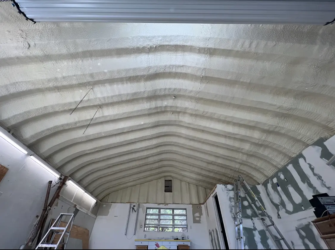 Spray polyurethane foam applied to the underside of a metal roof deck in Eliot